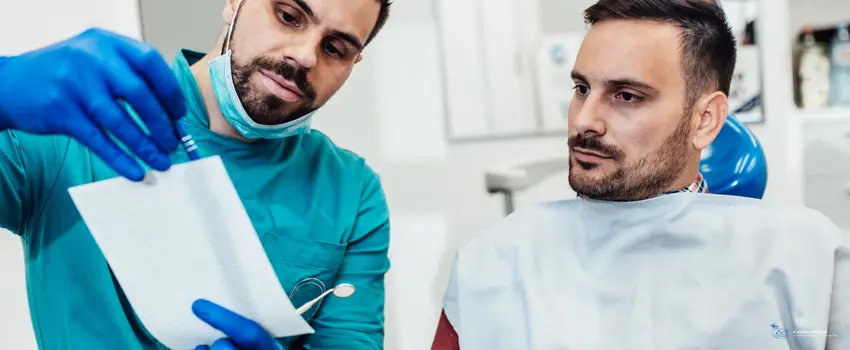 CD-Anxious man consulting with a dentist