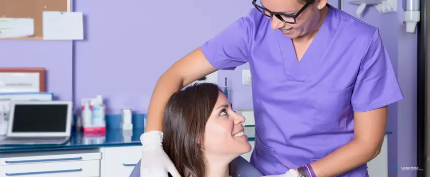 CD-Dental hygienist making the patient feel comfortable