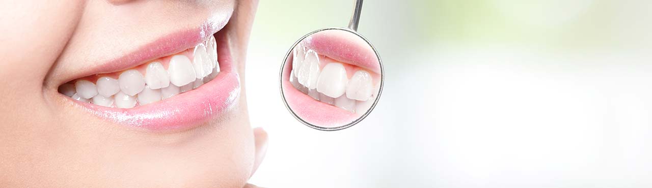 CD-Healthy woman teeth and dentist mouth mirror