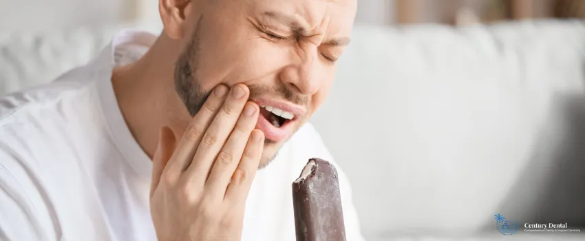 CD - Man with toothache holding a chocolate ice cream